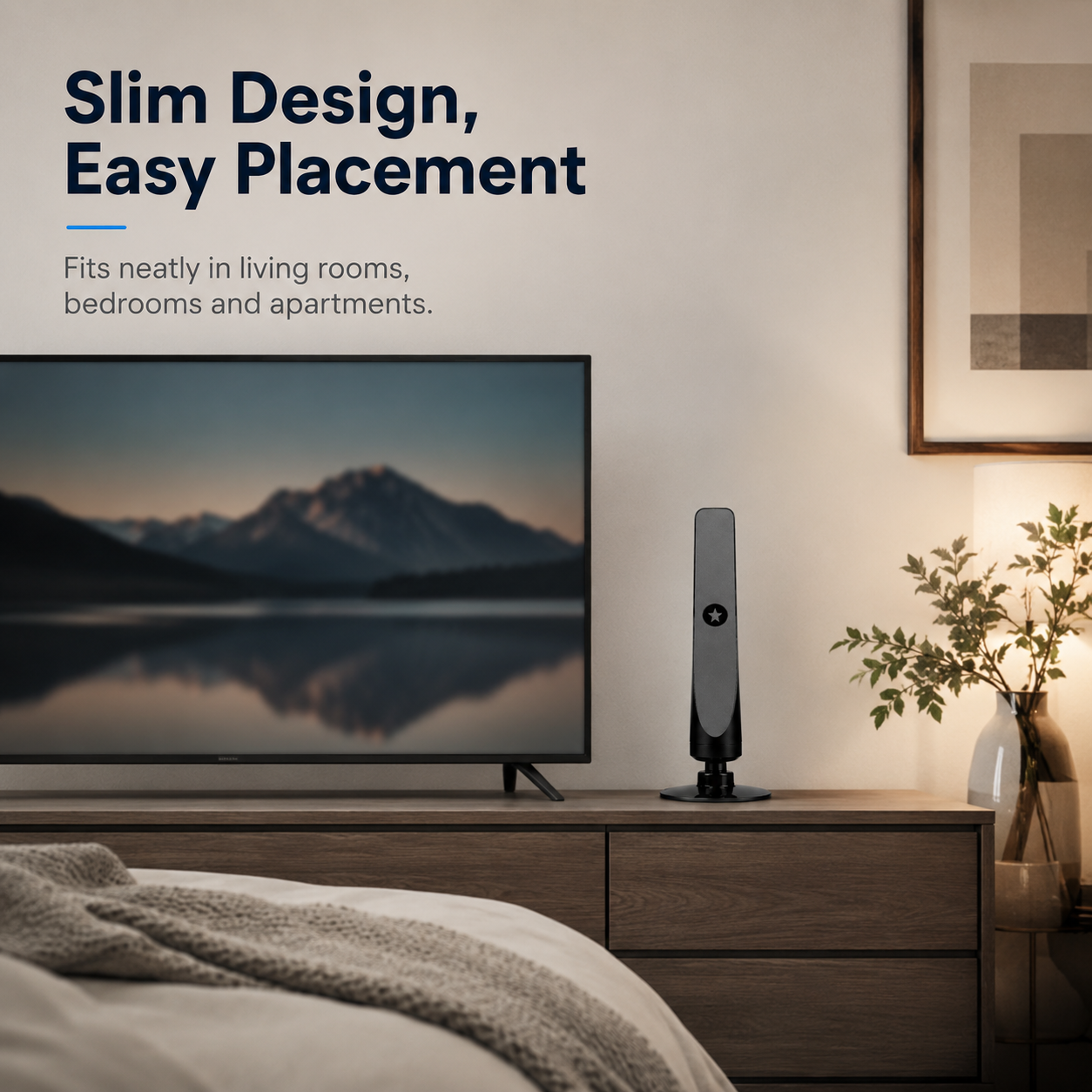 Slim indoor HDTV antenna positioned beside television in bedroom